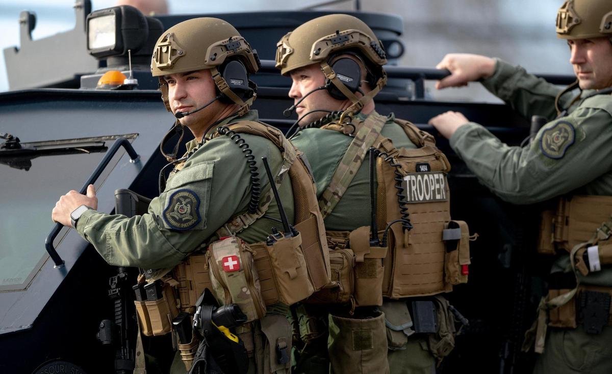 Missouri Highway Patrol SWAT team members leave the scene of a standoff in the 2300 block of Blue Ridge Boulevard on Wednesday, March 1, 2023, in Kansas City.