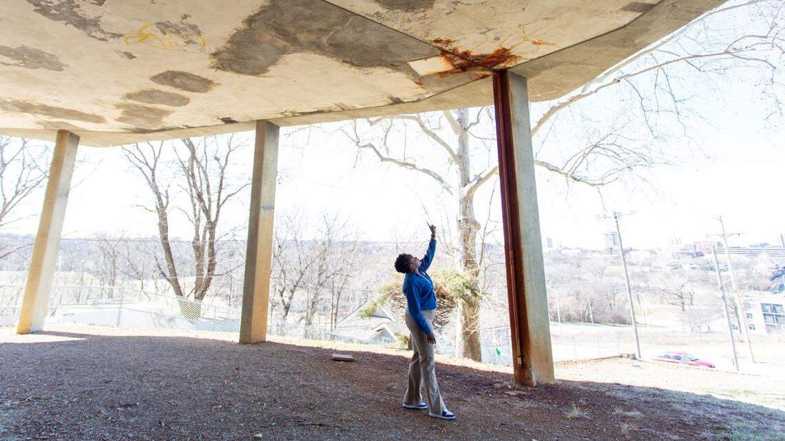 Lincoln College Preparatory Academy Principal Shanelle Smith stands under part of a building addition known as “the pods,” pointing out damage where a pipe froze, burst and then refroze. A Kansas City Public Schools bond plan calls for the deteriorating pods to be replaced with a new addition.