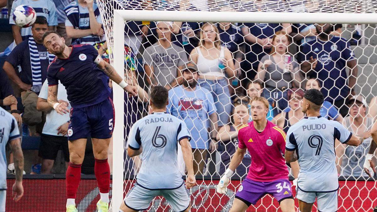 Chicago Fire defender Rafael Czichos heads the ball away from his team’s goal on Saturday evening at Children’s Mercy Park in Kansas City, Kan.