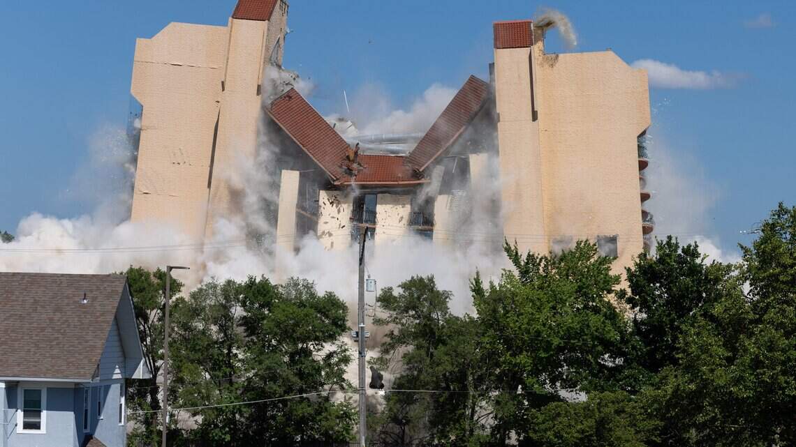 Former Embassy Suites hotel is imploded with dynamite as crowd looks on. See the video
