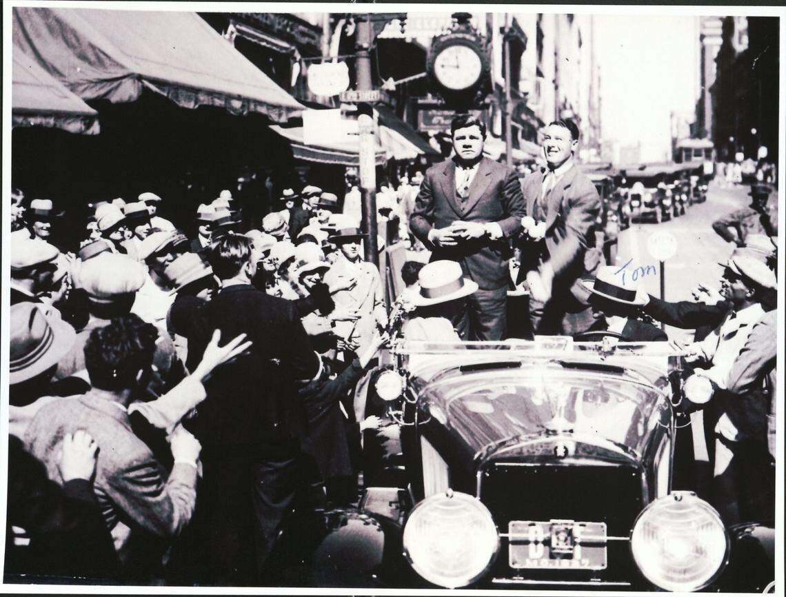 Kansas Olympian Tom Poor crossed paths with other legendary athletes, including New York Yankees star Babe Ruth (standing, left) during a parade. Poor, according to his daughter, is driving the car.