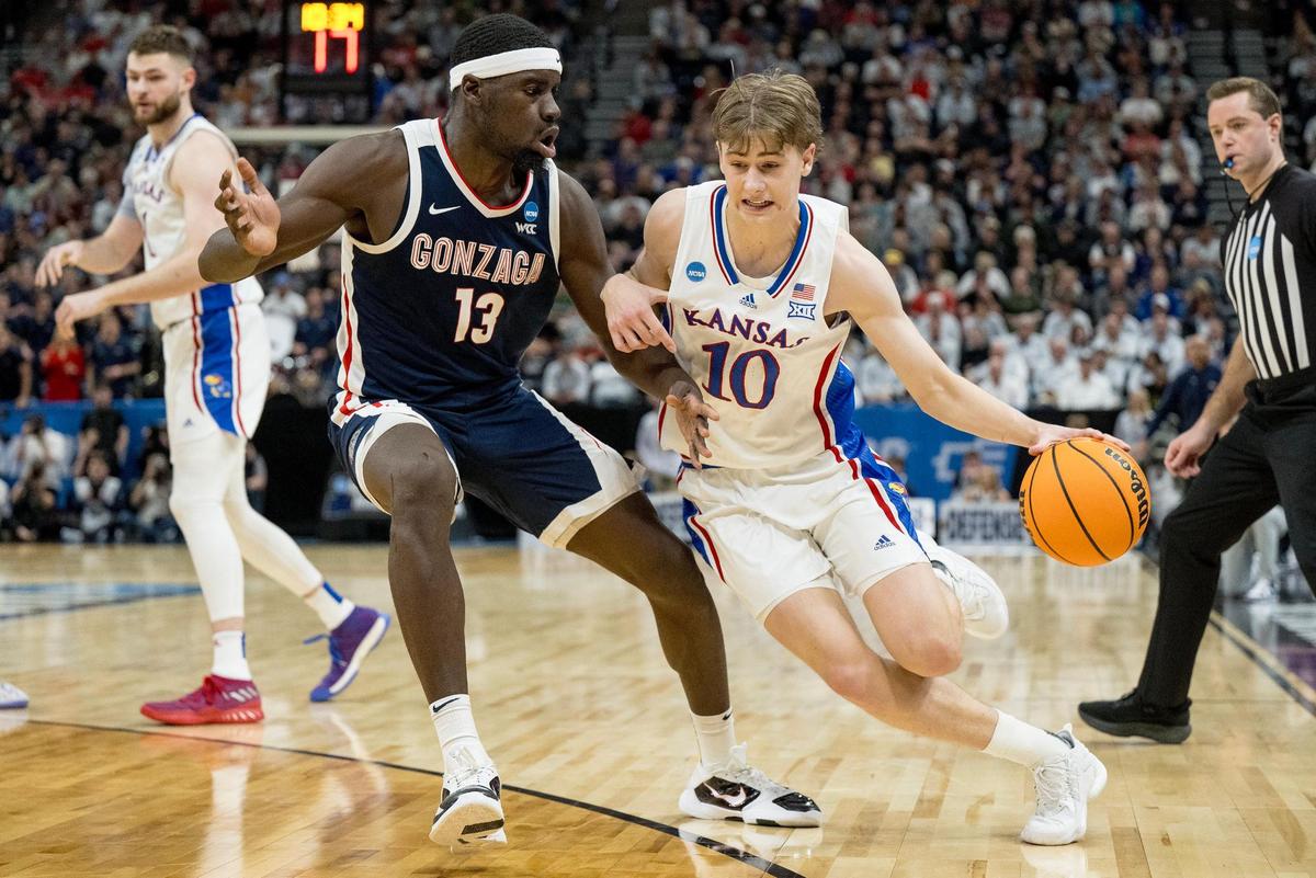 Gonzaga Bulldogs forward Graham Ike (13) guards Kansas Jayhawks guard Johnny Furphy (10) during a men’s college basketball game in the second round of the NCAA Tournament on Saturday, March 23, 2024, in Salt Lake City, Utah.