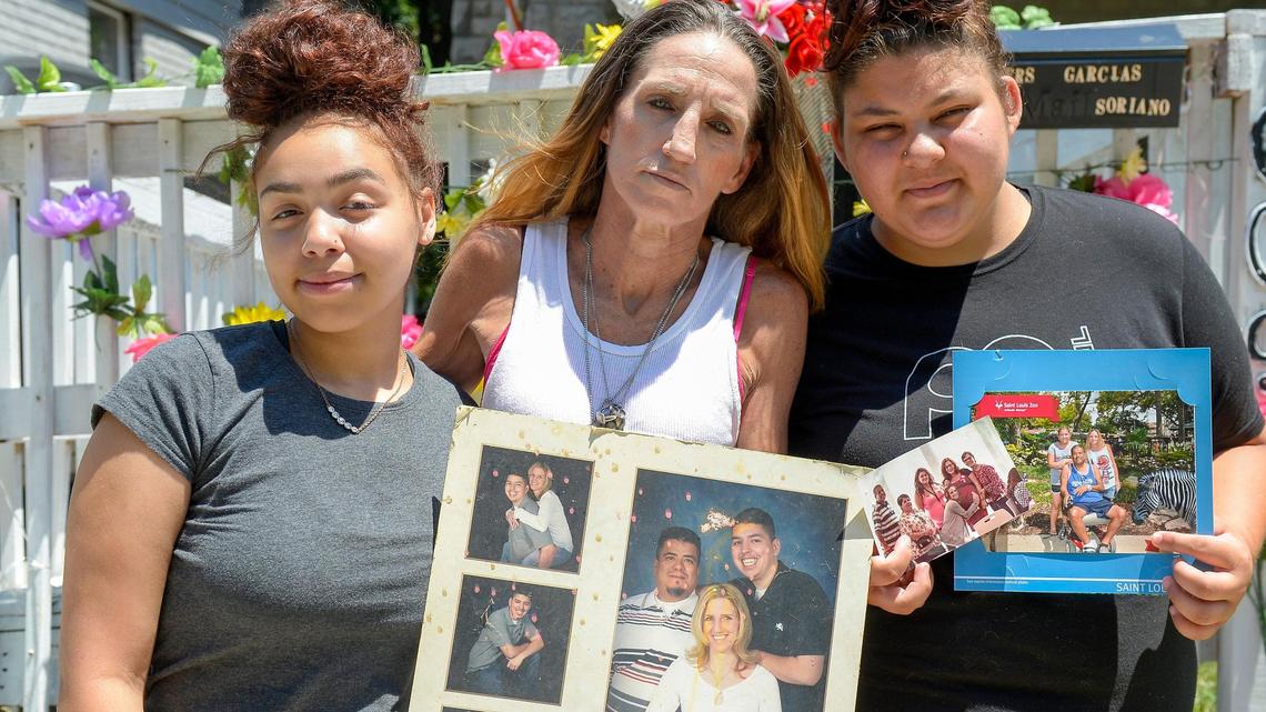 Talysa Smith, 14, family friend, Rhonda Garcia, wife of Paul Garcia, and Rhonda Sorino, 16, niece of Paul Garcia, pose with image of Paul outside of Garcia’s home. Paul Garcia was fatally shot inside his home on the evening of Monday, June 22, 2020.