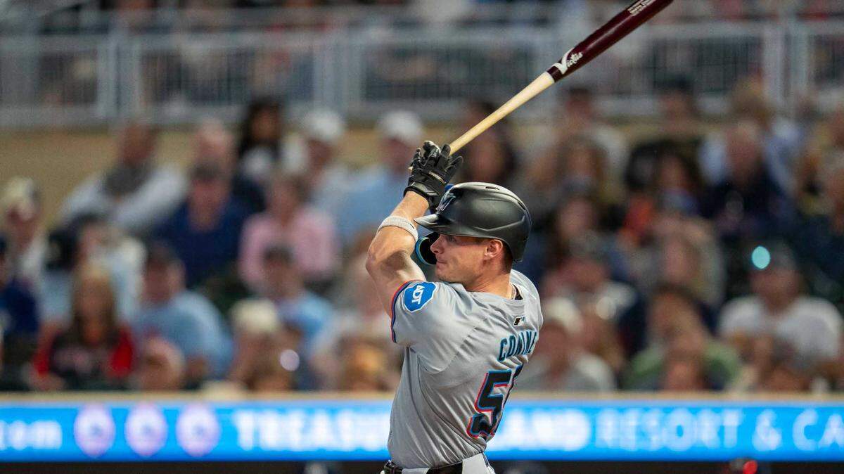 Miami Marlins left fielder Griffin Conine (56) hits a single against the Minnesota Twins in the third inning at Target Field on Wednesday.