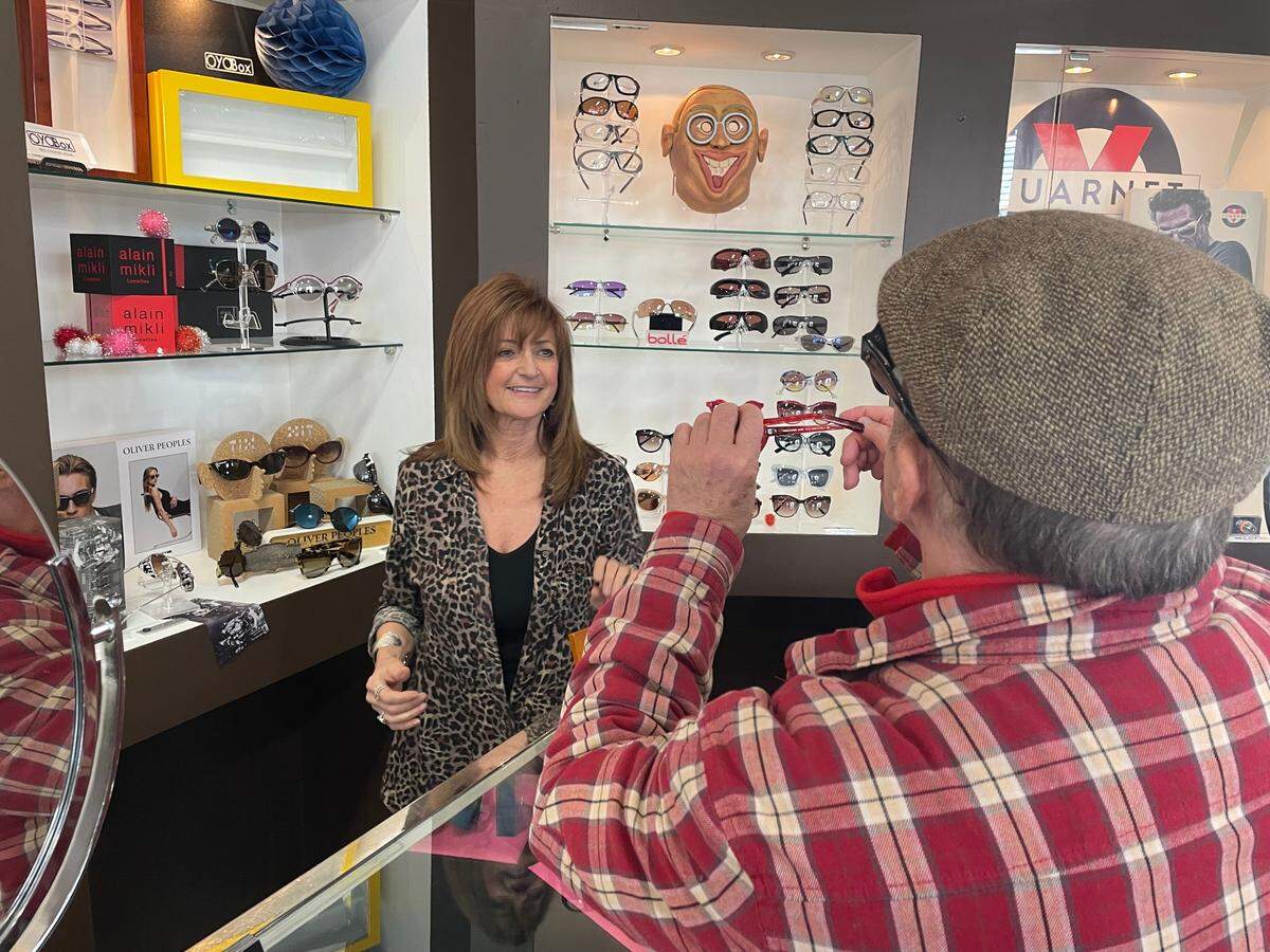 Debbie Gifford helped a customer at Optical Innovations on Wednesday afternoon. She is closing the shop after 37 years in business.