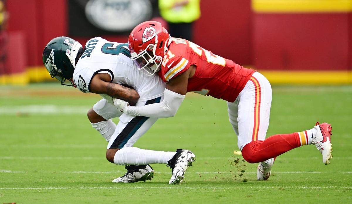 Kansas City Chiefs safety Jaden Hicks tackles Philadelphia Eagles wide receiver DeVonta Smith in the first quarter on Sunday, Sept. 14, 2025, at GEHA Field at Arrowhead Stadium.