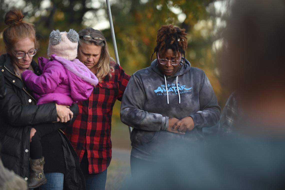 Lori Patton, 54, Yajieraka Chambers, 29, both of Excelsior Springs, were among roughly three dozen people who gathered Saturday evening under a monument cross at Siloam Mountain Park to pray as police investigate a local man being investigated for kidnapping and rape, and possibly other crimes.