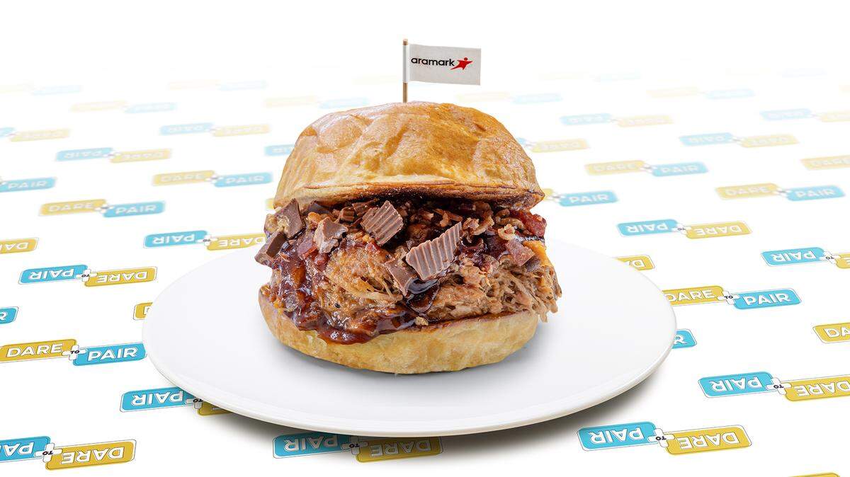 Kauffman Stadium’s new BBQ Reese’s Sandwich with pulled pork, Sweet Baby Ray’s barbecue sauce, crumbled Reese’s Peanut Butter Cups and bacon bits.