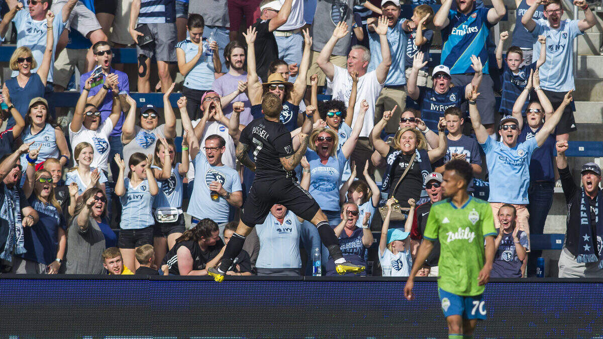 Sporting Kansas City forward Johnny Russell (7) celebrates in front of the Cauldron fans during the match against the Seattle Sounders on Sunday at Children’s Mercy Park.