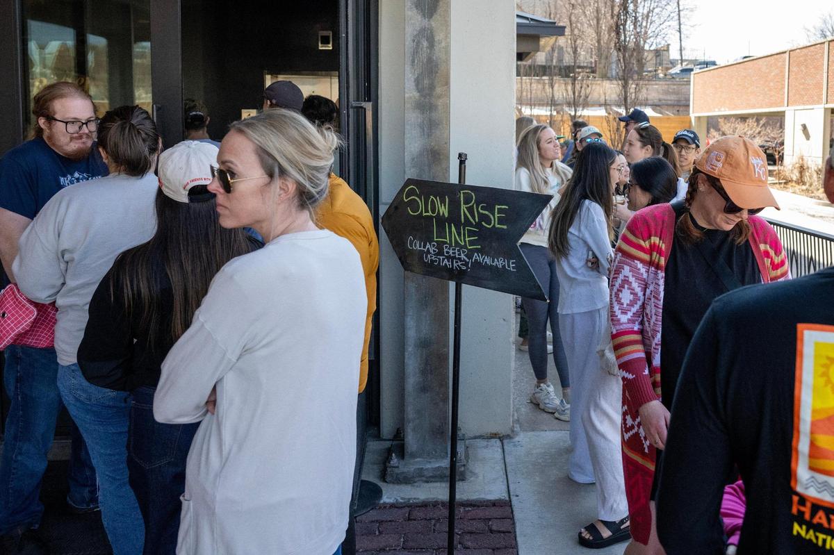 People stand in line for the Slow Rise Doughnuts pop-up during the Pandan Coconut Doughnut Ale release party at Boulevard Brewing Tours and Recreation Center on Sunday, March 9, 2025, in Kansas City. The pop-up featured Slow Rise’s signature sourdough doughnuts, including the pandan coconut flavor that inspired Boulevard’s unique beer collaboration.