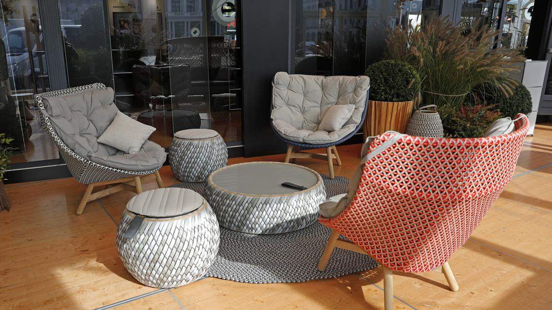 An outdoor porch with furniture.