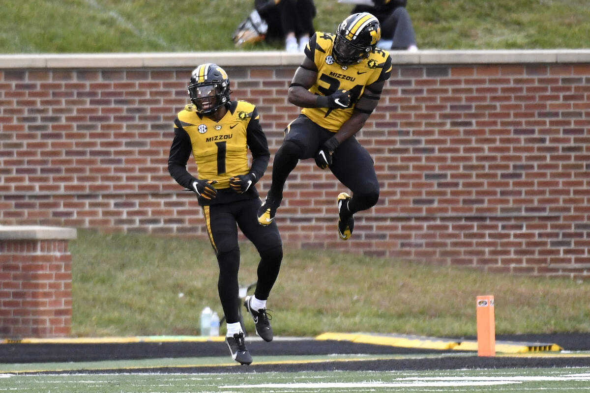 Missouri running back Larry Rountree III, right, celebrates with teammate Tyler Badie (1) after scoring on a 1-yard run during the second half of an NCAA college football game against Kentucky Saturday, Oct. 24, 2020, in Columbia, Mo. (AP Photo/L.G. Patterson)