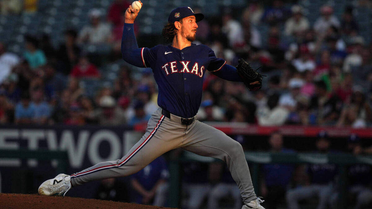Texas Rangers starting pitcher Michael Lorenzen (23) throws in the third inning against the Los Angeles Angels at Angel Stadium.