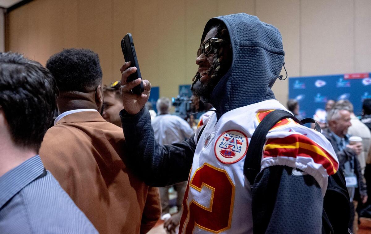 Kansas City Chiefs wide receiver Ihmir Smith-Marsette uses his phone to film wide receiver Skyy Moore as he talks with media members during the team’s media availability on Thursday, Feb. 9, 2023, in Scottsdale, Ariz.