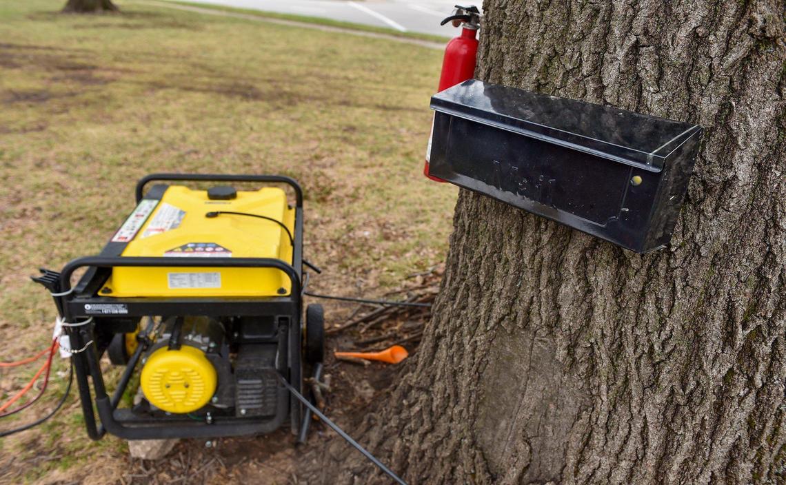 A camp for homeless people at Westport Road and Southwest Trafficway has a mailbox, generator and several fire extinguishers.