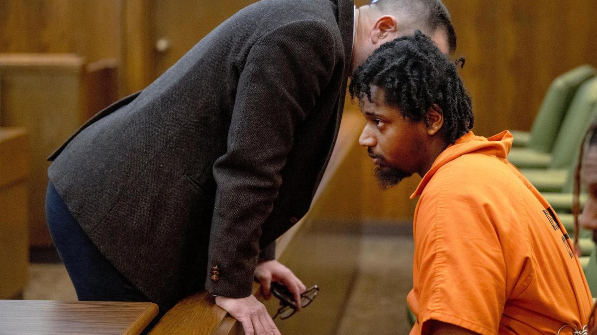 Lyndell Mays, one of the men charged with murder in the Kansas City Chiefs Super Bowl rally mass shooting, listens to his public defender, John Reed, before a bond hearing in Jackson County Circuit Court on Tuesday, March 5, 2024, in Kansas City.