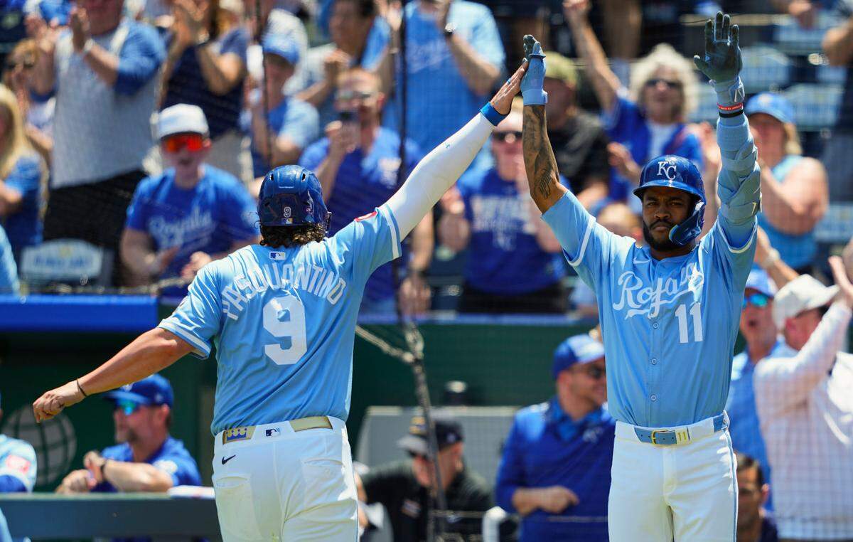 Royals first baseman Vinnie Pasquantino, left, celebrates with third baseman Maikel Garcia after scoring against the Chicago White Sox on Thursday, May 8, 2025 at Kauffman Stadium in Kansas City.