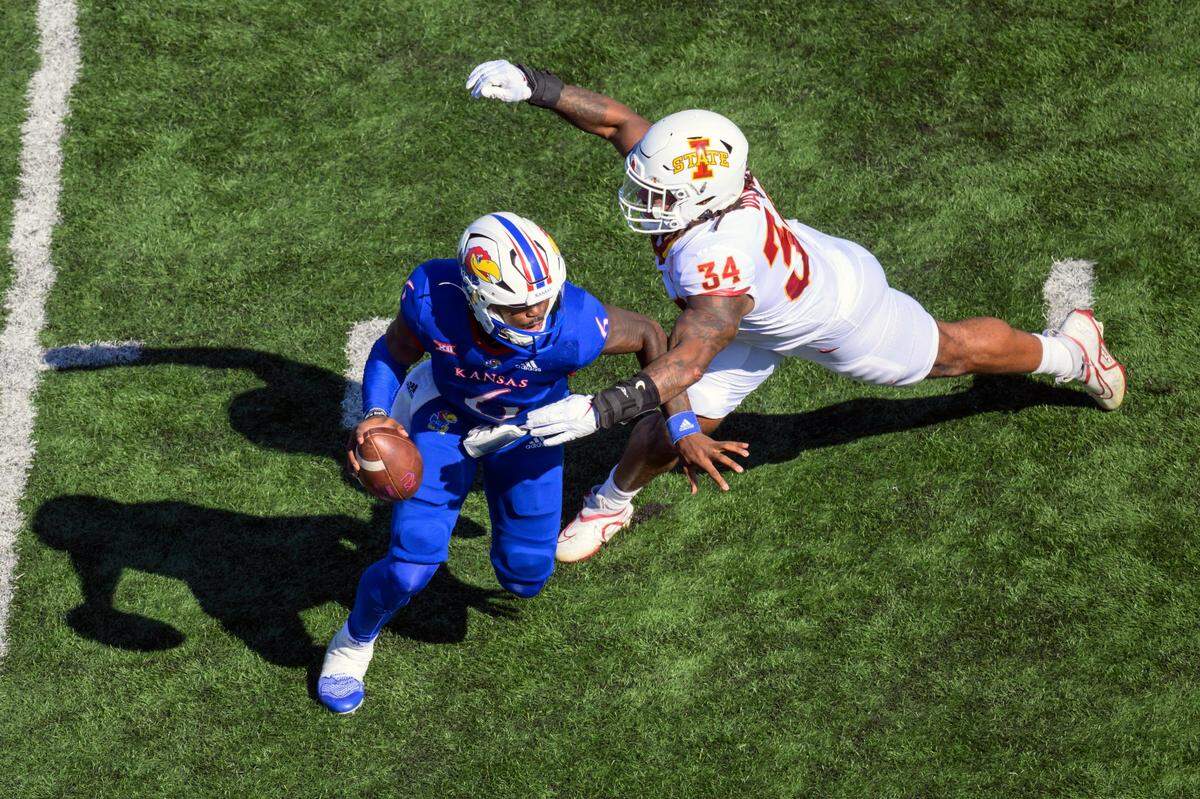 Iowa State linebacker O’Rien Vance (No. 34) pressures Kansas quarterback Jalon Daniels during the first half of last Saturday’s game in Lawrence.