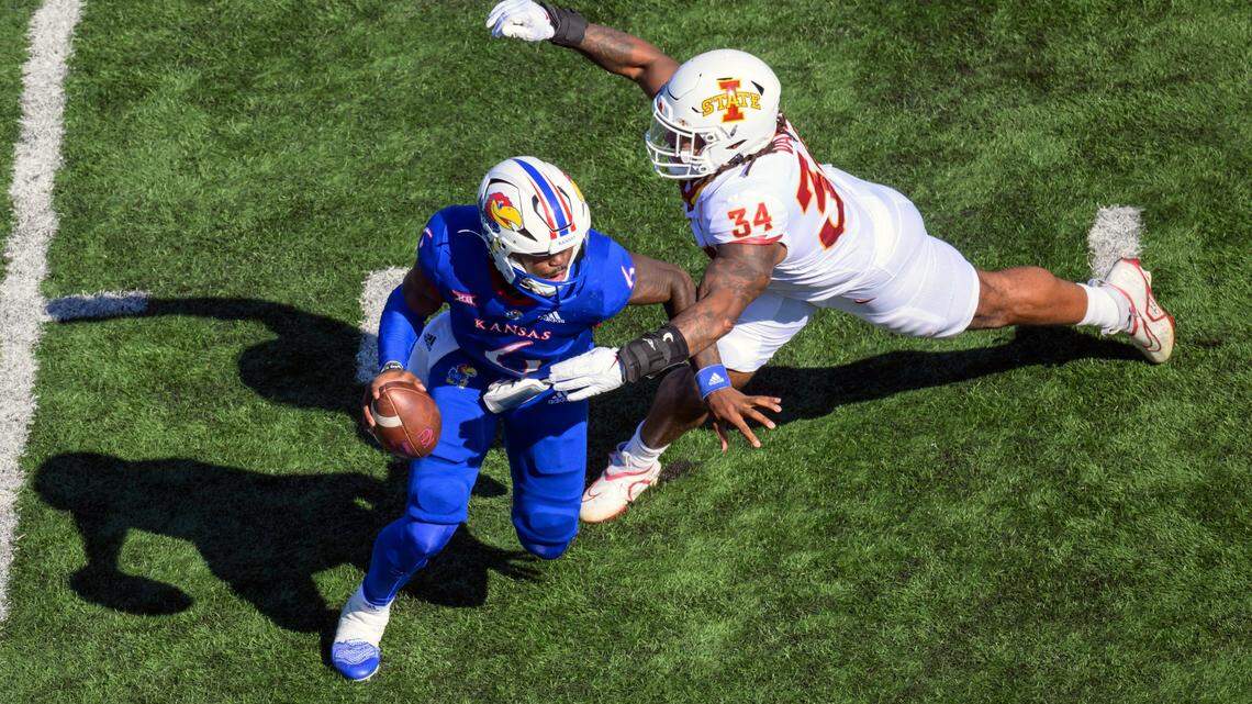 Iowa State linebacker O’Rien Vance (No. 34) pressures Kansas quarterback Jalon Daniels during the first half of Saturday’s game in Lawrence.