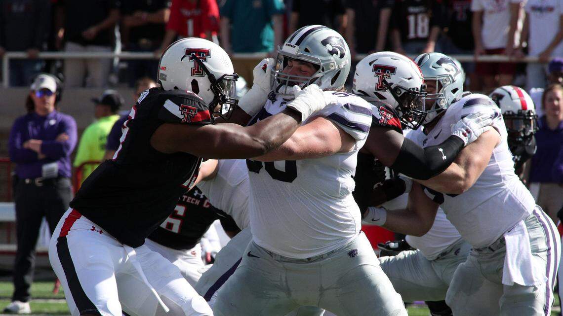Kansas State Wildcats offensive lineman Cooper Beebe (50) blocks Texas Tech Red Raiders defensive lineman Tyree Wilson (19) in the first half at Jones AT&T Stadium on Oct. 23, 2021.