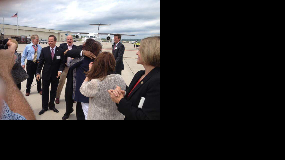 
Kansas City Mayor Sly James hugs RNC site selection committee chairwoman Enid Mickelsen after a quick dance at the downtown airport.
