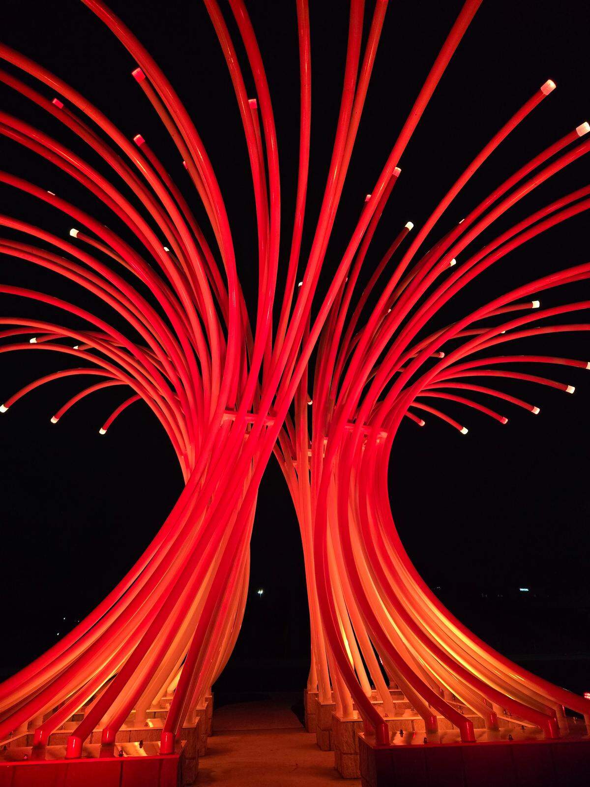The “Reaching” sculpture in Leawood will be lit in red lights Tuesday for the Swift-Kelce engagement.