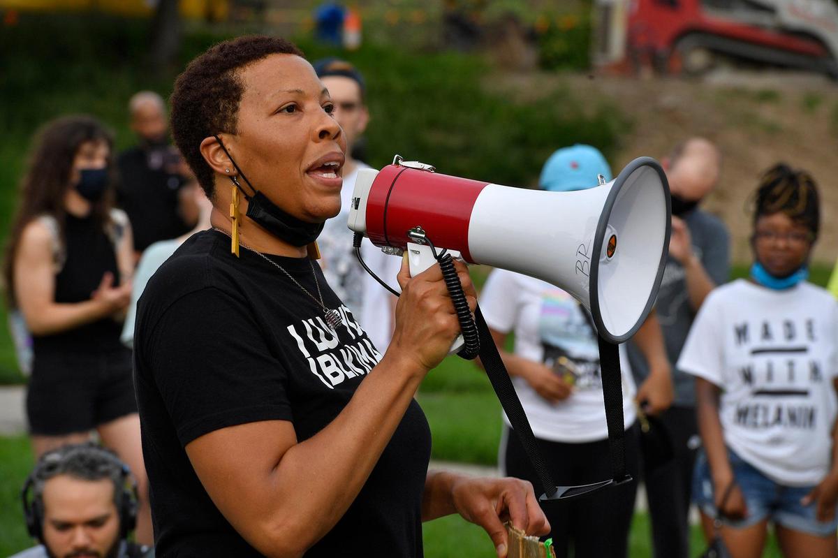 .Shafeeqa Small, of Kansas City, spoke to the crowd gathered at Mill Creek Park before they marched through the streets of the plaza in memory of Floyd, who was killed one year ago by a police officer in Minneapolis, Minnesota. The event was organized by Black Rainbow of Kansas City.