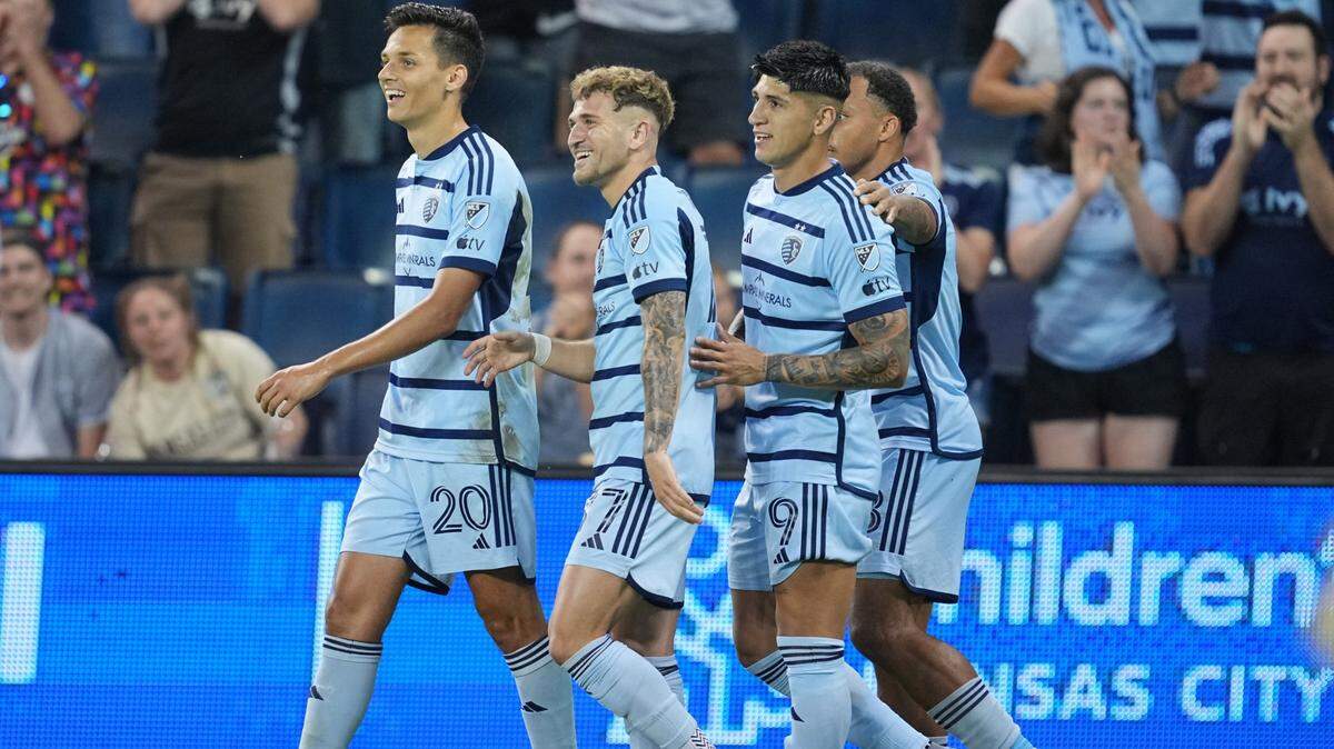 Sporting Kansas City forward Daniel Salloi (20) celebrates with teammates after scoring a goal during the second half against the FC Dallas at Children’s Mercy Park.
