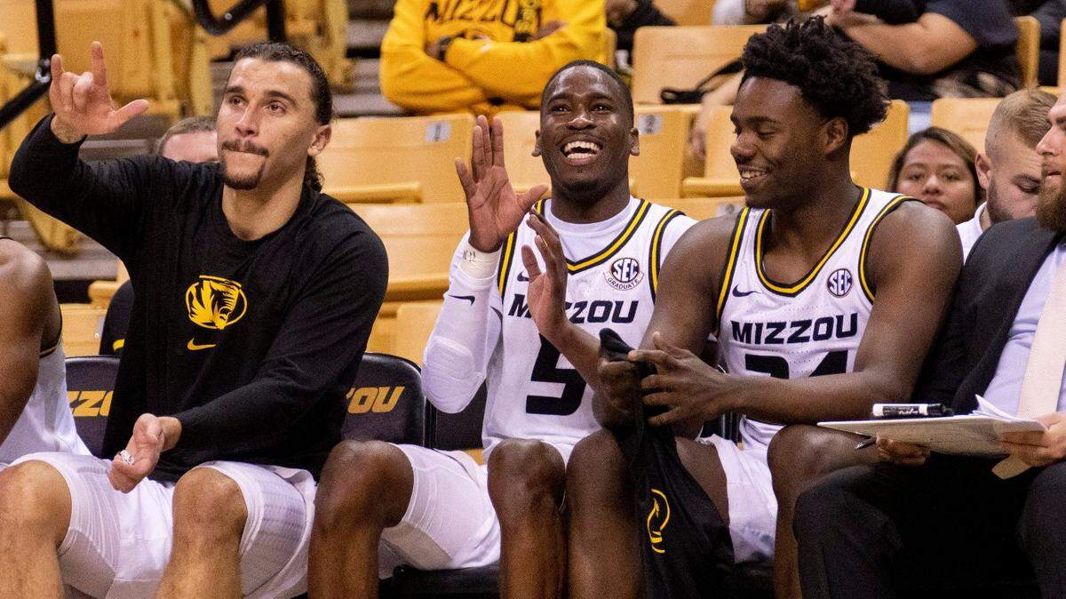 Missouri’s D’Moi Hodge, center, laughs with teammates on the bench late in the second half of last week’s game against SIU-Edwardsville at Mizzou Arena.
