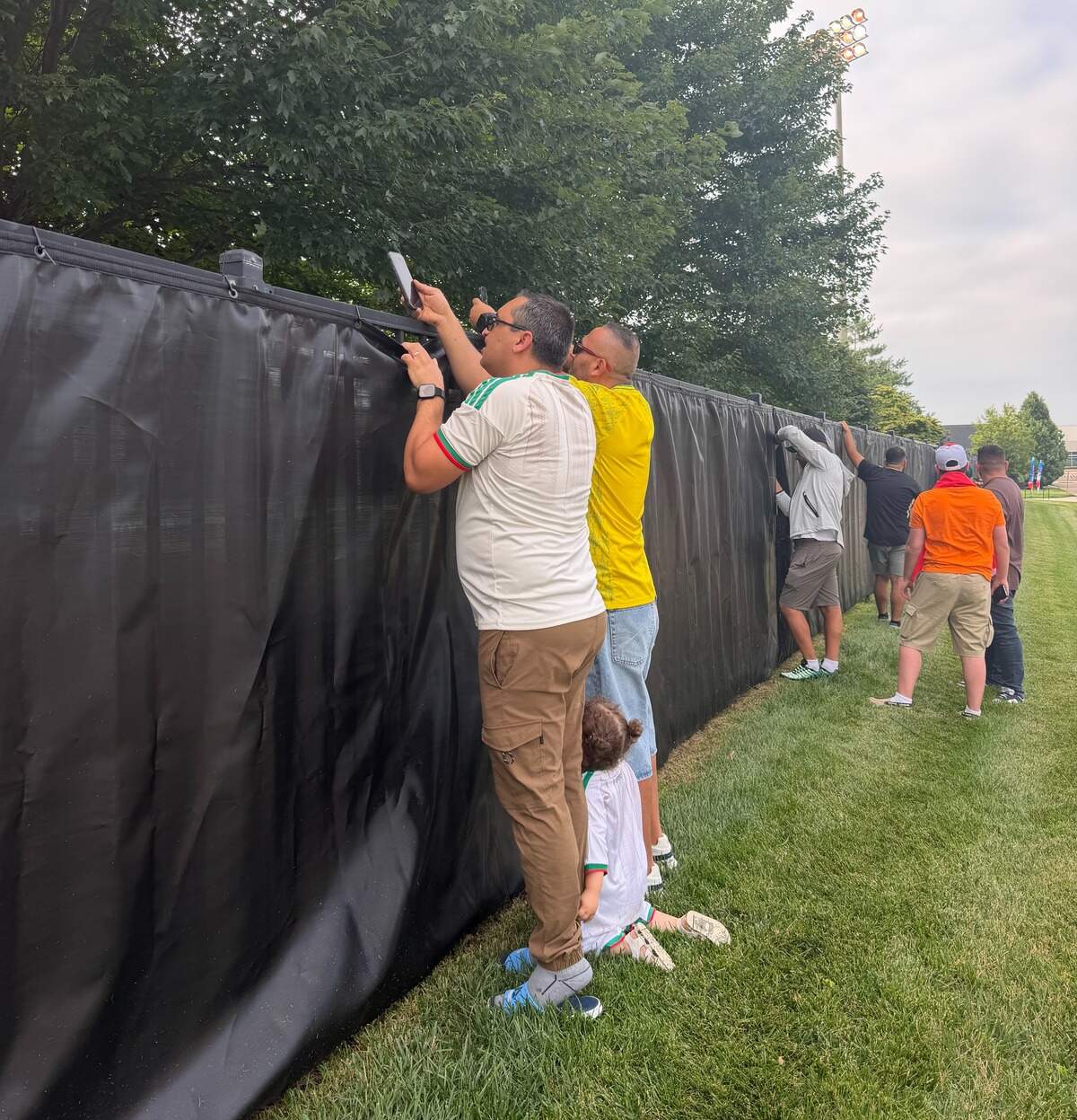 Fans of the Algeria men’s national team gather at Rock Chalk Park, hoping to see their team practice on June 8, 2026.