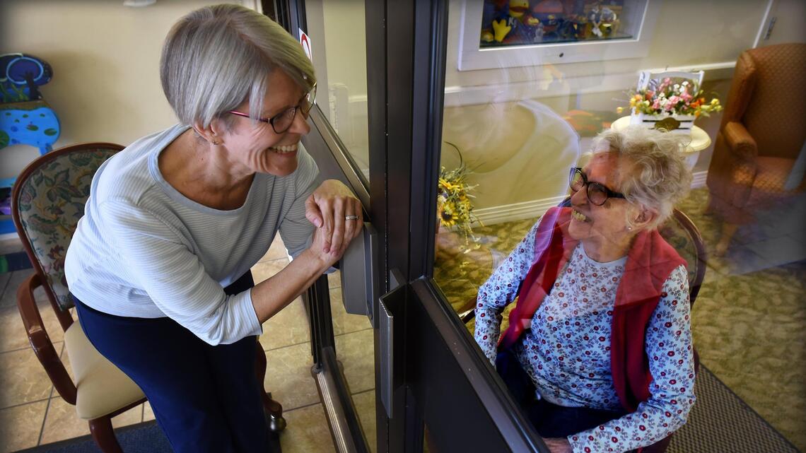 ‘I love you, Mama’: COVID-19 and glass separate Kansas daughter and mom turning 100