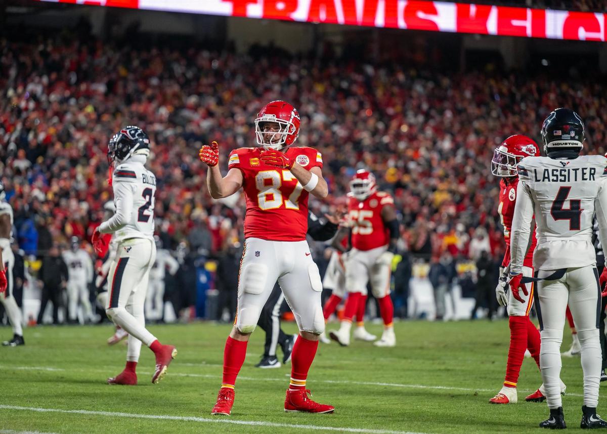 Kansas City Chiefs tight end Travis Kelce (87) gestures for a first down after his run the second half of the AFC Divisional Round playoff game on Saturday, Jan. 18, 2025, at GEHA Field at Arrowhead Stadium. The Chiefs defeated the Texans 23-14.