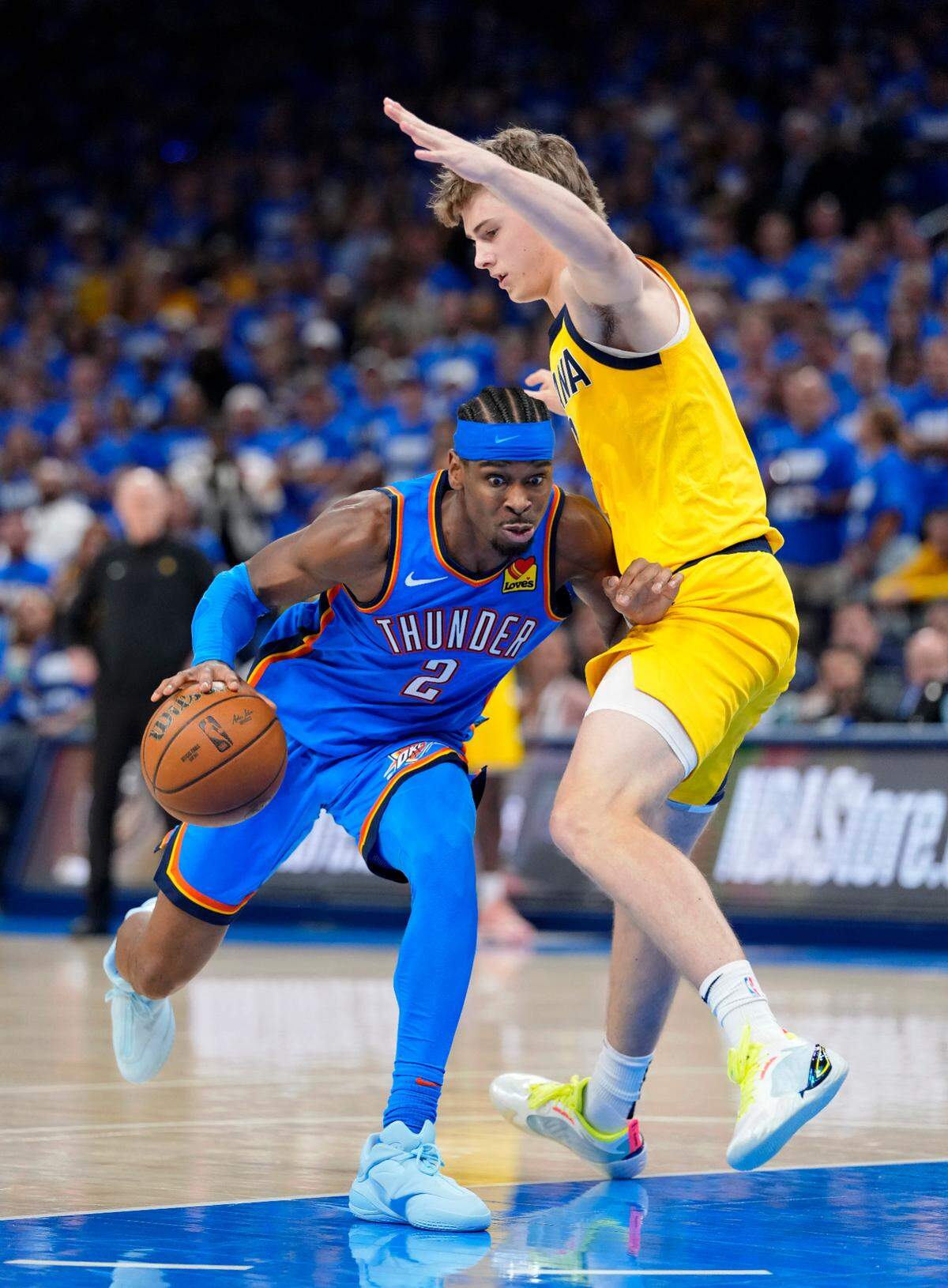 Oklahoma City Thunder guard Shai Gilgeous-Alexander (2) drives to the basket against Indiana Pacers forward Johnny Furphy (12) during the second half of Game 2 of the 2025 NBA Finals at Paycom Center on June 8, 2025.
