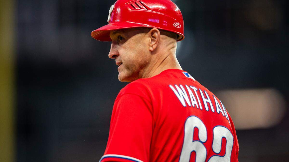 Philadelphia Phillies third base coach Dusty Wathan looks out field during the sixth inning of a baseball game against the Atlanta Braves Thursday, May 26, 2022, in Atlanta. (AP Photo/Hakim Wright Sr.)