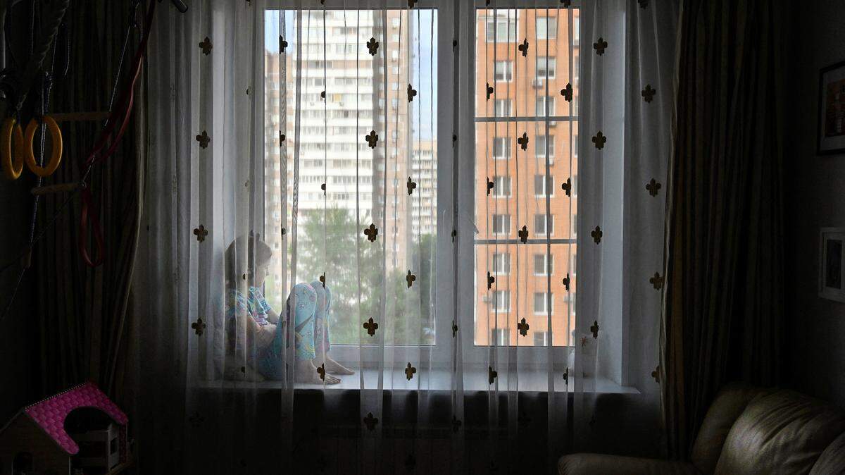 Curtain across a window. (Photo by Alexander NEMENOV / AFP) (Photo by ALEXANDER NEMENOV/AFP via Getty Images)