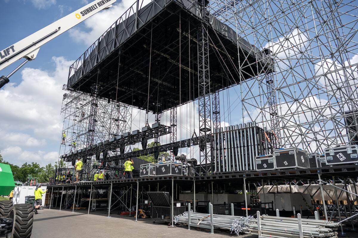 Construction crews set up the main stage at the FIFA Fan Festival site during a media walkthrough at the National WWI Museum and Memorial on Wednesday, May 27, 2026, in Kansas City.