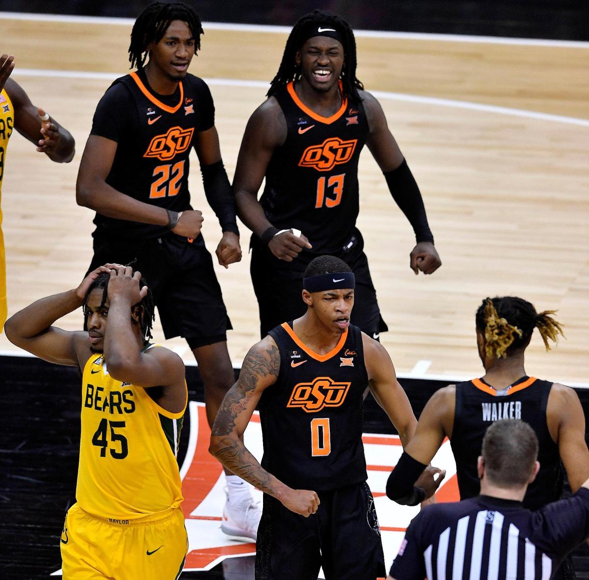 After Oklahoma State’s Avery Anderson (0) made a driving leaner to ice Friday night’s semifinal win over Davion Mitchell (45) and Baylor, the celebration could begin for the Cowboys. They will take on Texas in Saturday’s final of the Big 12 Tournament at the T-Mobile Center.