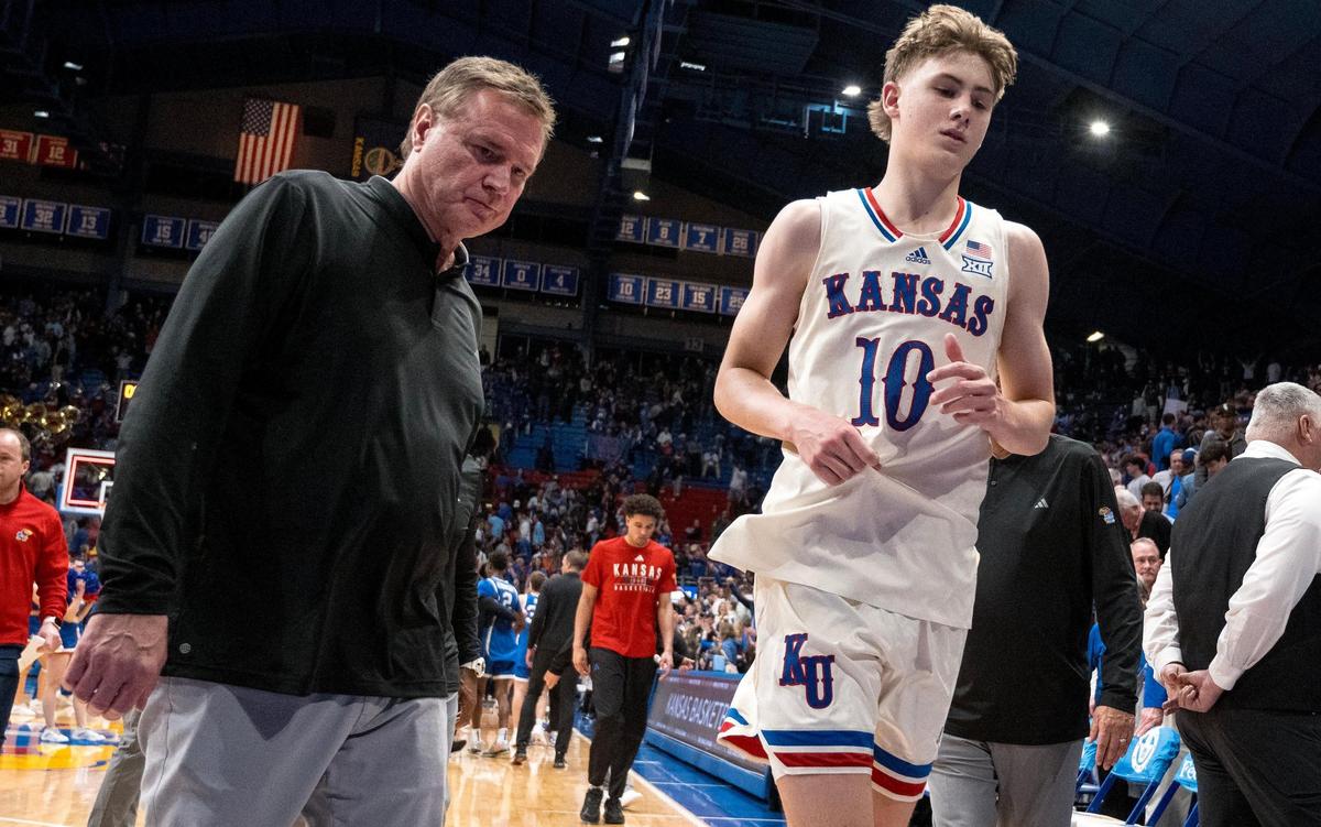 Kansas Jayhawks guard Johnny Furphy (10) and head coach Bill Self exit the court after the BYU Cougars defeated the Jayhawks 76-68 in an NCAA college basketball game on Tuesday, Feb. 27, 2024, in Lawrence.