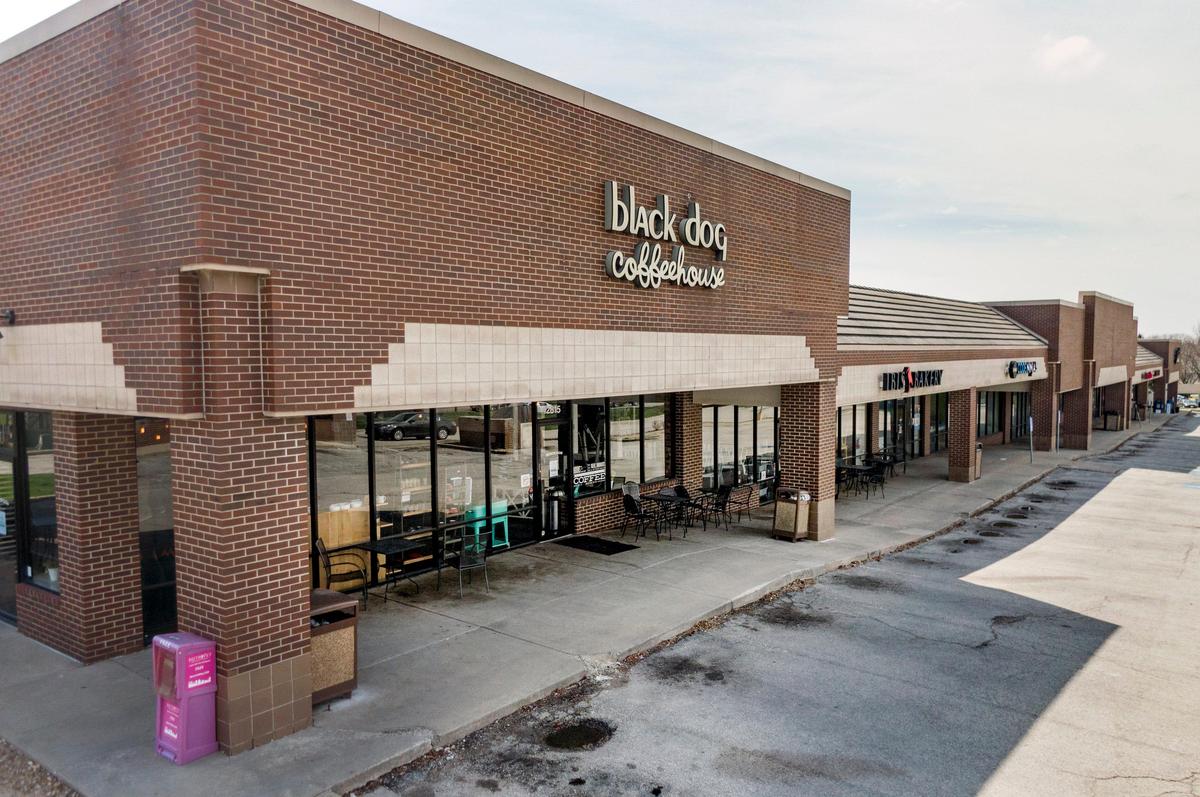 A parking lot remains empty outside of Black Dog Coffeehouse in Lenexa, which has closed its inside food service and laid off most of its workers in the midst of the coronavirus pandemic. They are still doing a carryout business.