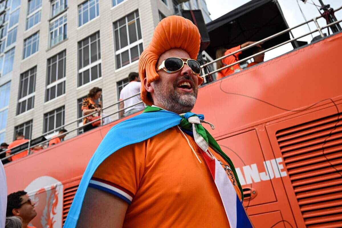 A fan decked out in orange and is ready to join in the Netherlands Orange Walk from Kansas City's Power & Light District to FIFA Fan Fest on June 25, 2026.