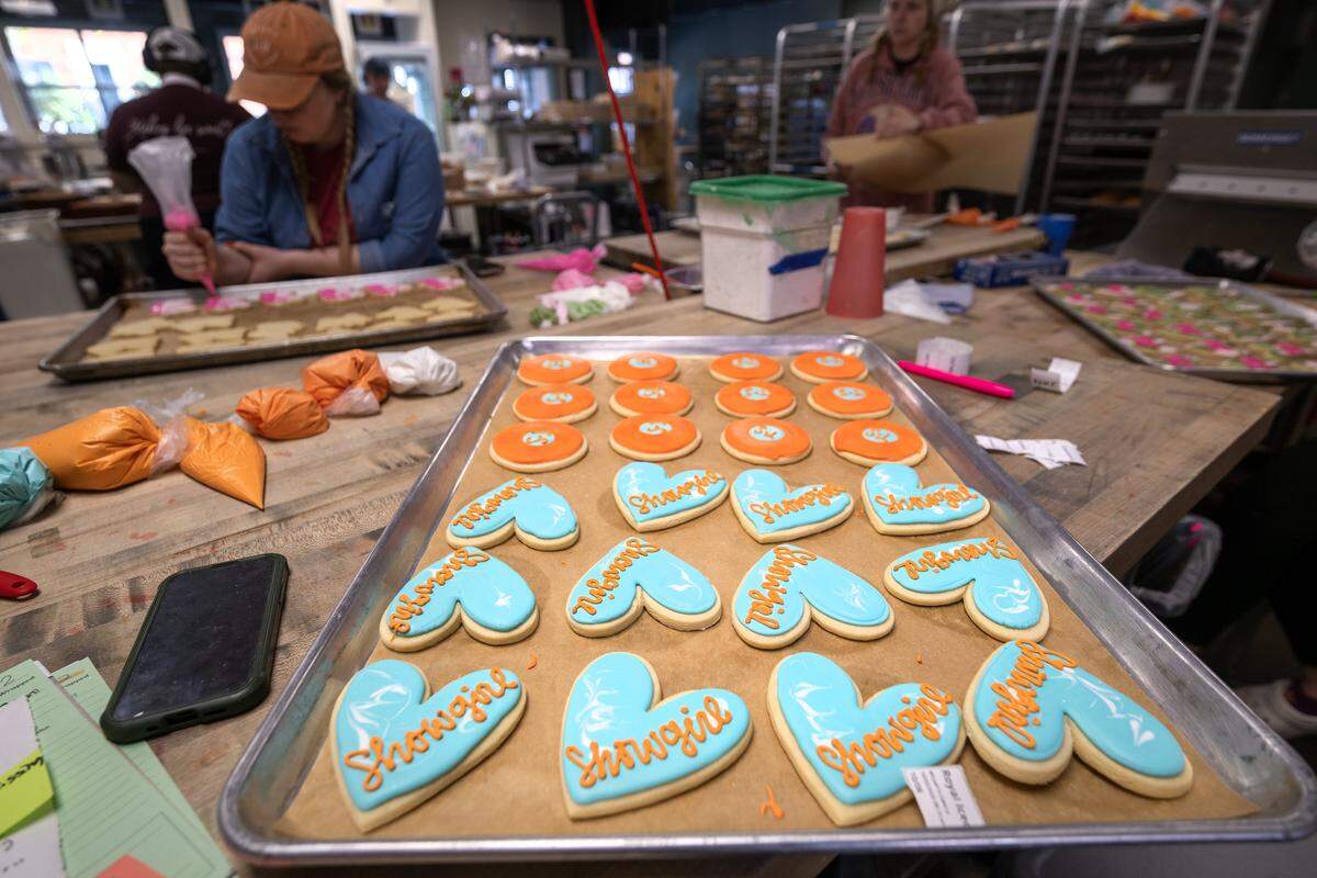 Taylor Swift-themed cookies being made at McLain's Bakery in Waldo. Local bakeries are seeing a significant demand for cookies to celebrate pop stars Taylor Swift and Chappell Roan.