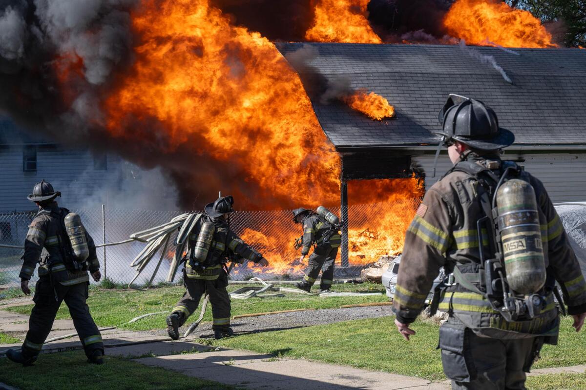Kansas City firefighters respond to a house fire near the intersection of Norton Avenue and East 26th Street in Kansas City on Tuesday, April 15, 2025.