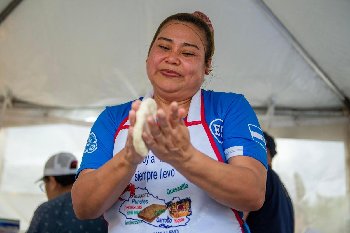 Martha Sijuemza shapes pupusa dough during the Cinco de Mayo celebration at Guadalupe Centers on Friday, May 5, 2023, in Kansas City.