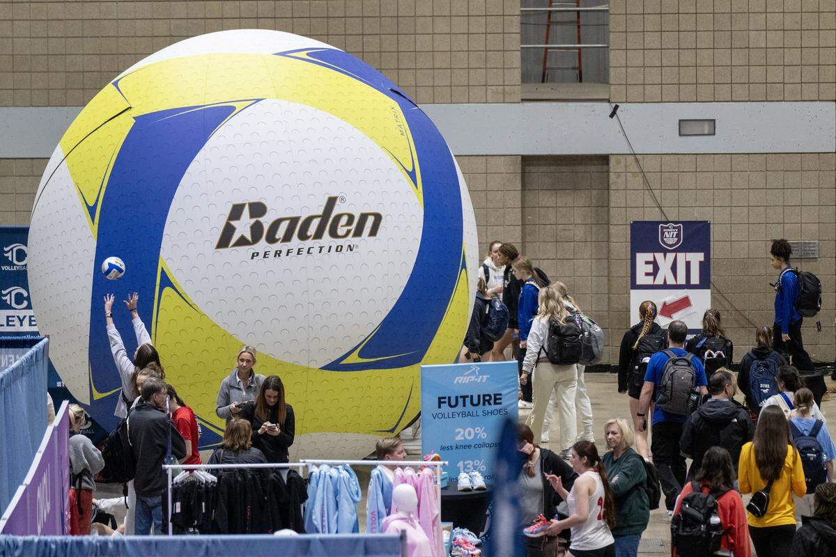 Spectators and players view vendor displays at the Triple Crown Women’s National Invitational Tournament (NIT), an elite-level youth volleyball tournament which brings about 40,000 people, including 687 teams, to Kansas City. The teams compete on courts setup at three venues including Bartle Hall at the Kansas City Convention Center on Sunday, Feb. 15, 2026.