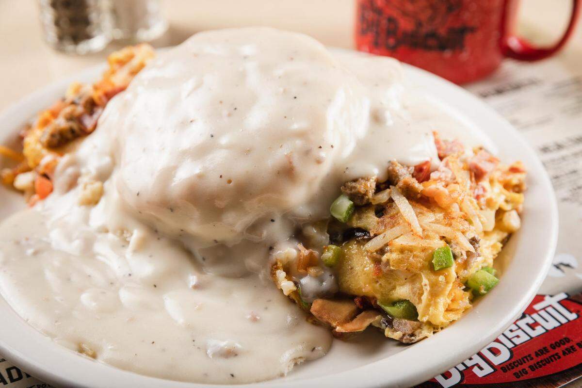 The Big Biscuit’s The Titanic - biscuit and gravy on top of a 4-egg omelet filled with ham, bacon, sausage, mushrooms, tomatoes, green peppers, onions, hash browns and cheddar cheese.