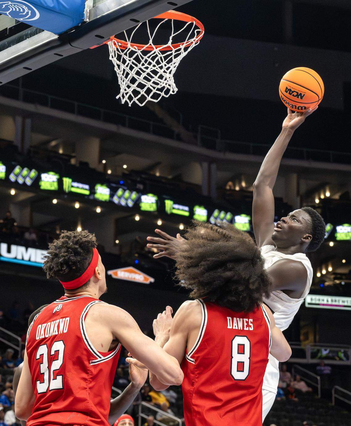 Cincinnati Bearcats center Moustapha Thiam (52) makes a lay up against Utah Utes during the second half of the Big 12 Men's Basketball Tournament at T-Mobile Center on Tuesday, March 10, 2026, in Kansas City.