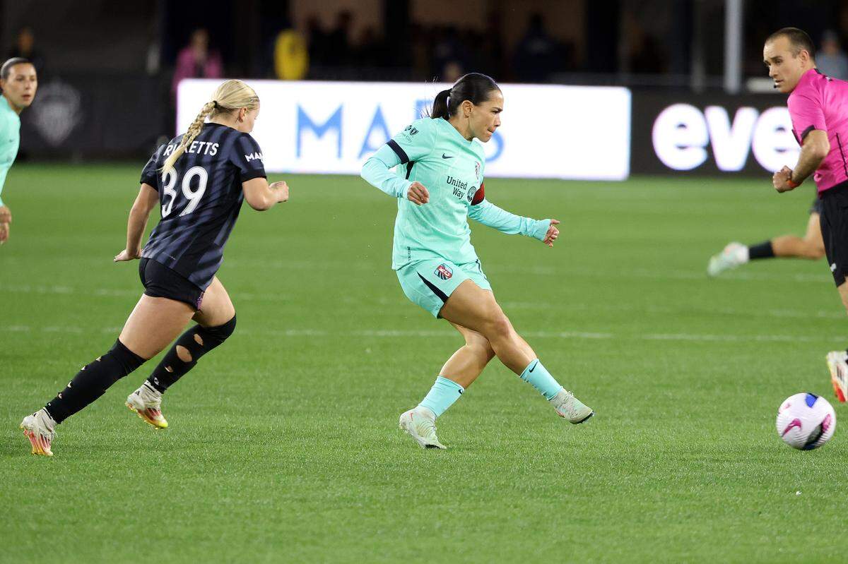 Kansas City midfielder Lo’eau LaBonta (10) passes the ball past Washington Spirit forward Chloe Ricketts (39) during the first half at Audi Field on March 22, 2025.