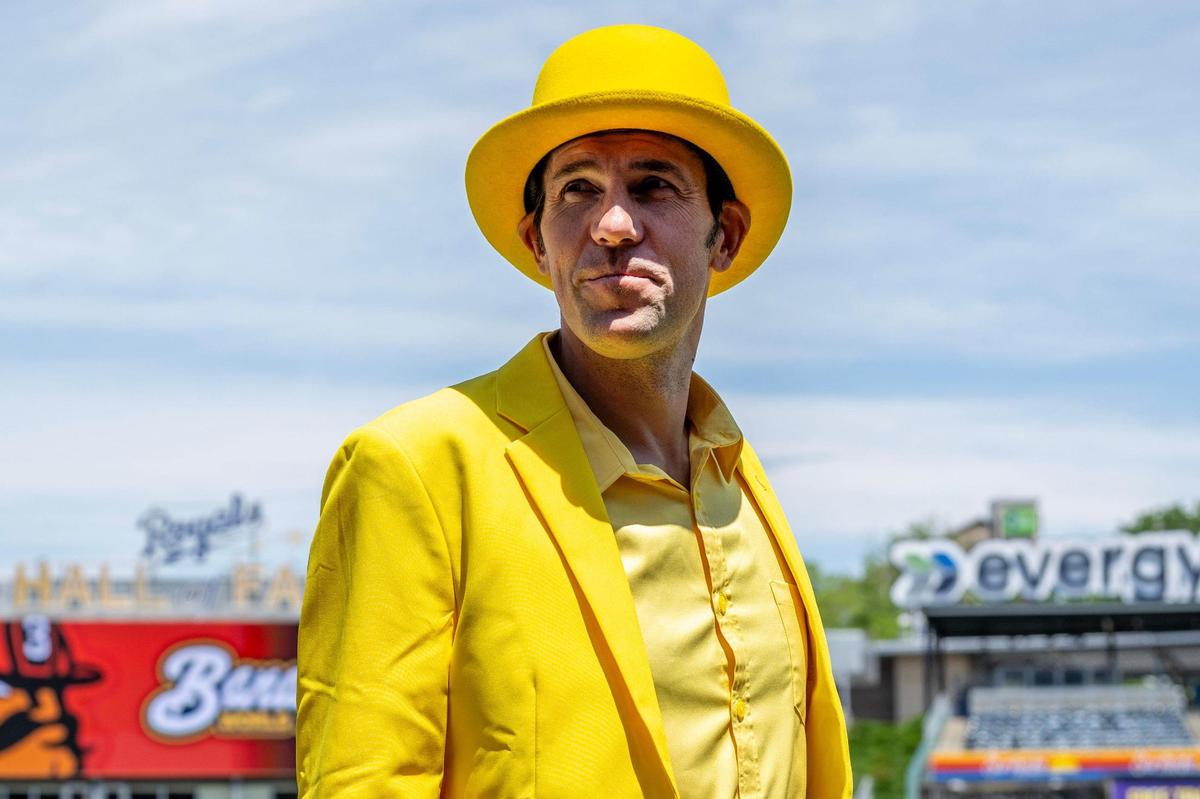Savannah Bananas owner Jesse Cole wears a yellow suit while walking on the field during practice before a Banana Ball game against the Firefighters at Kauffman Stadium on Friday, May 23, 2025, in Kansas City.
