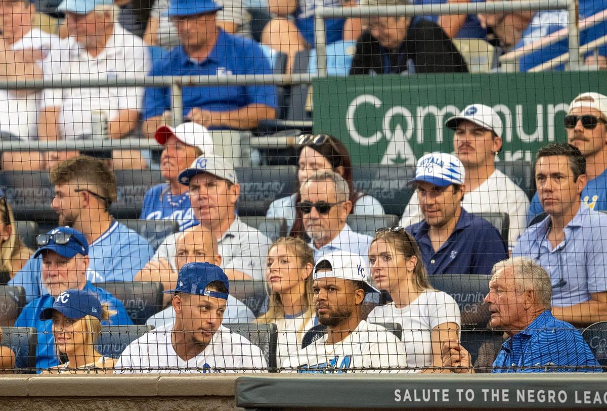 Brittany Mahomes, left, and Patrick Mahomes, who talks to Royals great George Brett, took in the Kansas City Royals game against the New York Yankees on Tuesday, June 10, 2025, at Kauffman Stadium in Kansas City.