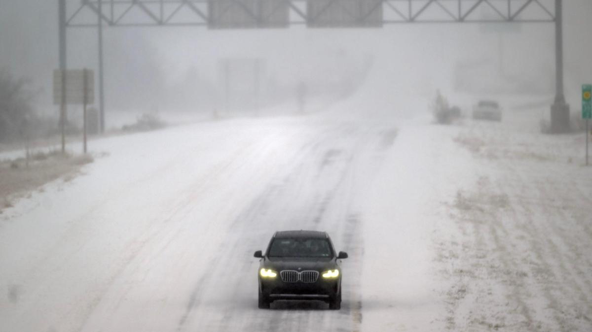 Snow-packed roads and blizzard conditions were slowing a driver on Sunday, Jan. 5.